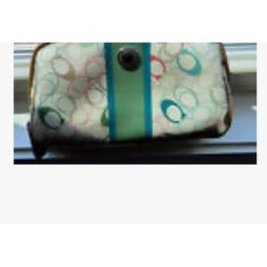 Coach multicolored cosmetic bag. Matching wristlet sold separately in my closet.